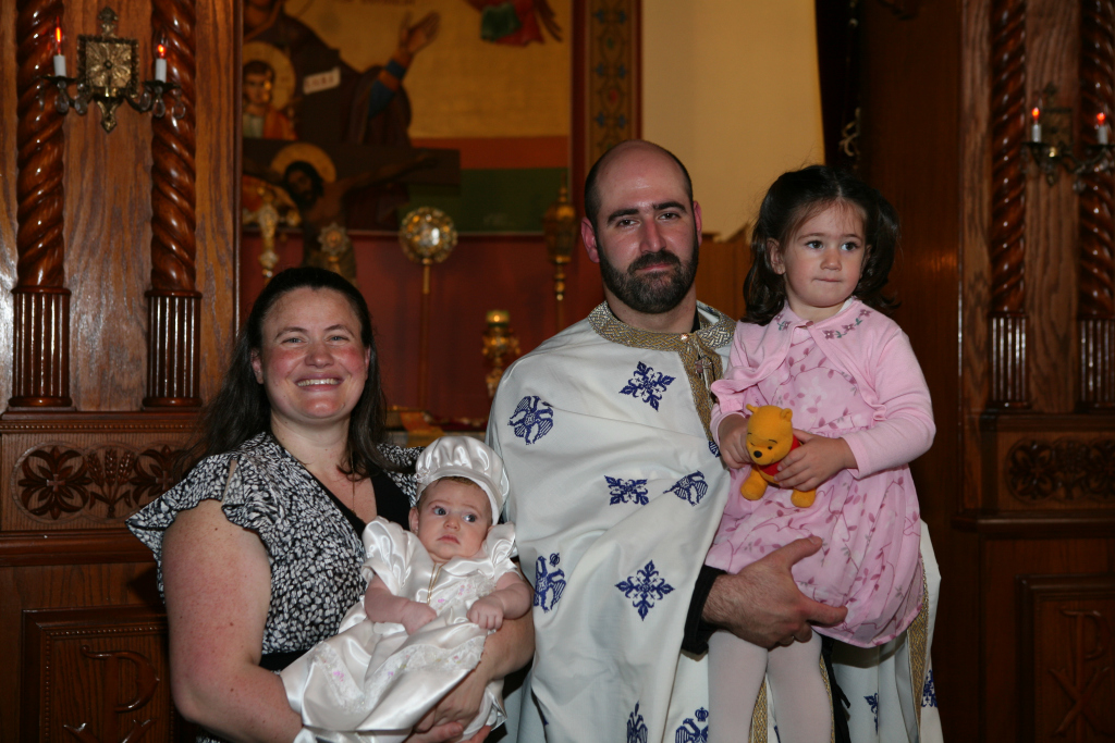 Fr. C. and Presbytera Dina, with their two oldest children, Maria and Joanna.